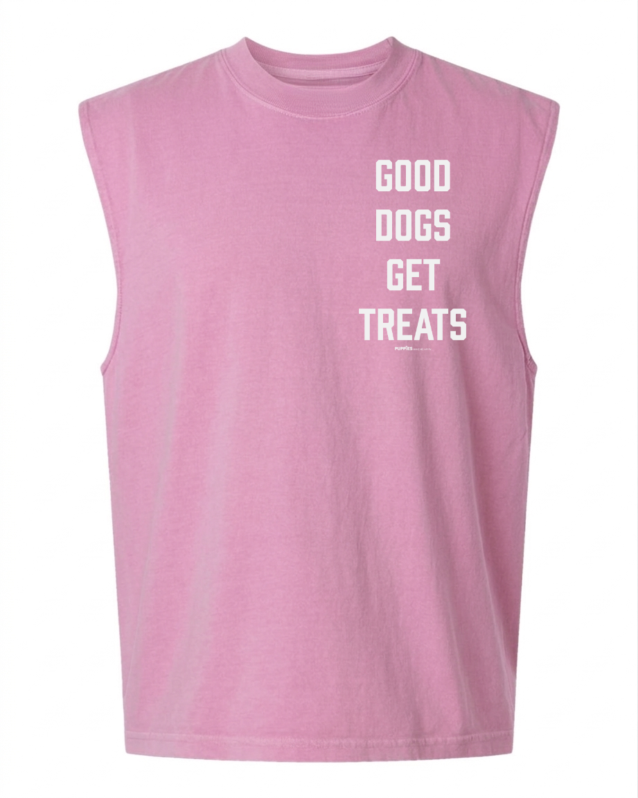 Good Dogs Get Treats Unisex Heavyweight Muscle Tank in vintage washed pastel pink with white vertical text.
