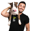 Man holding a dog with a black shirt with phrasing " Fitness Goal : Pet More Dogs "